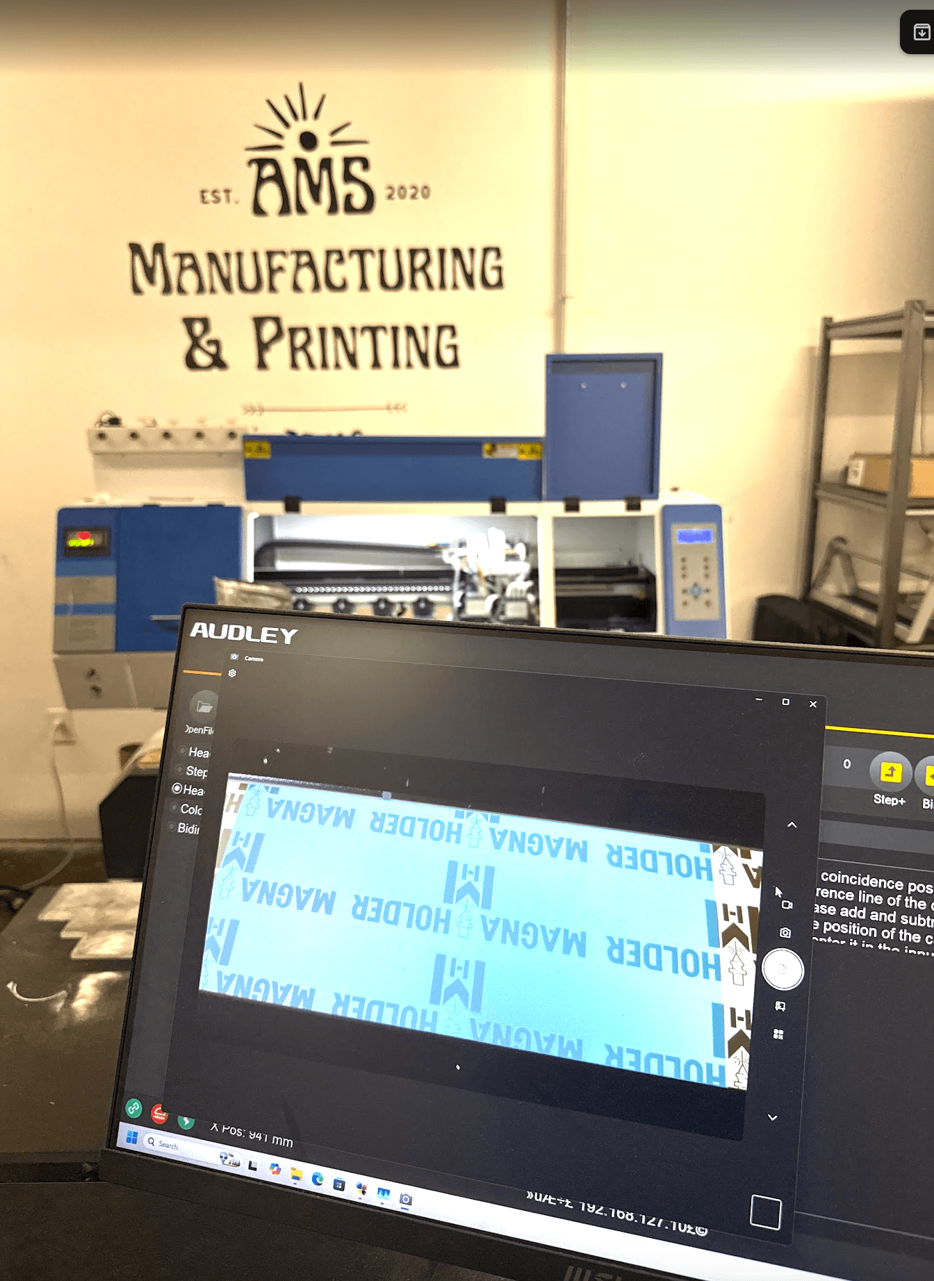 DTF printer detail for custom apparel production at AMS