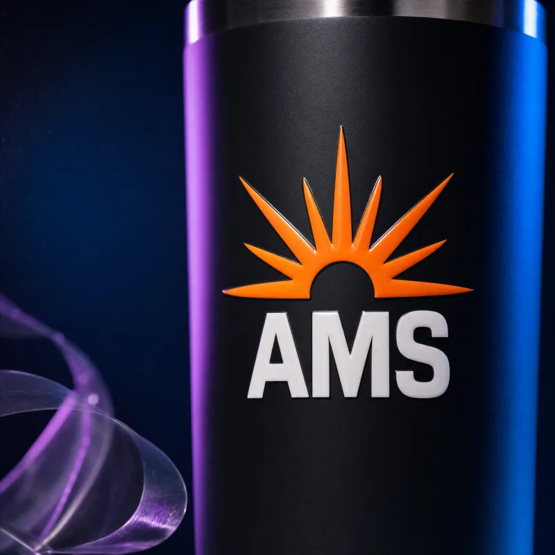 The finished tumbler with only the design left and the empty carrier film peeling away