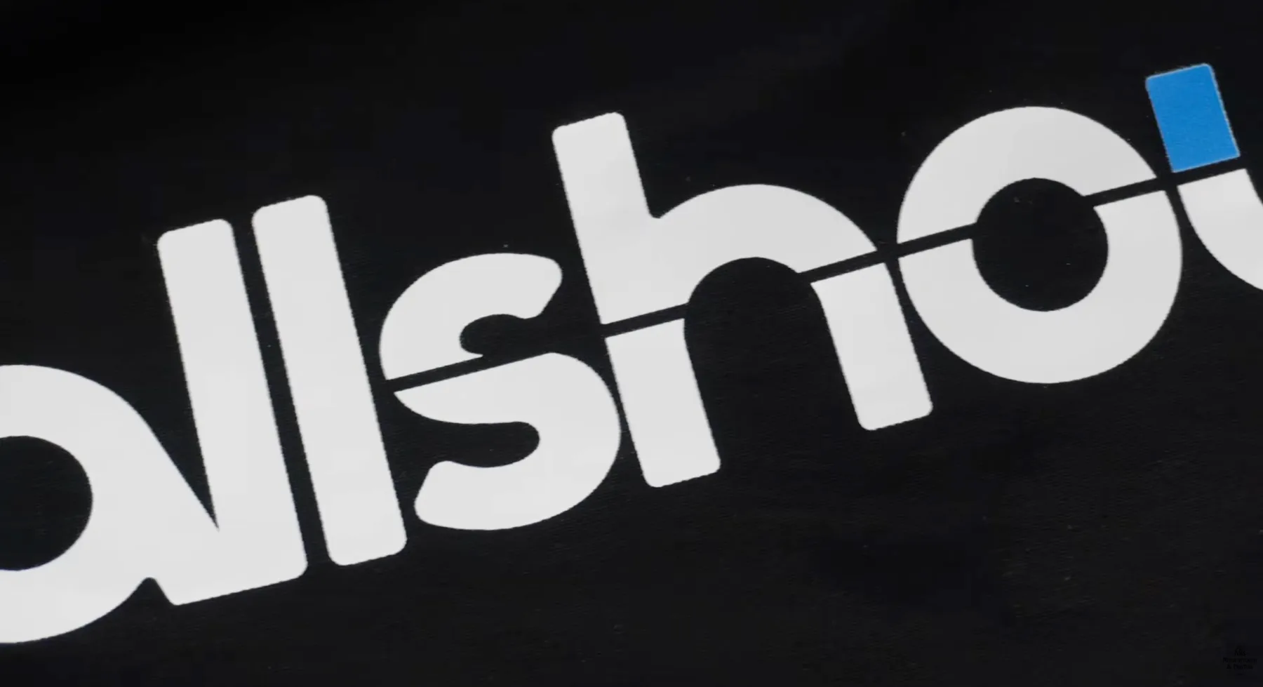 Close-up of a large white and blue DTF back print on a black Gildan DryBlend shirt
